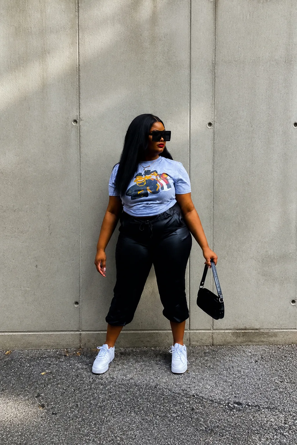 Edgy graphic tee and black leather street style